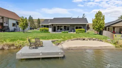 Relax in a backyard featuring stunning 75-foot waterfront views and your own private dock.