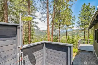 Outdoor shower with mountain views