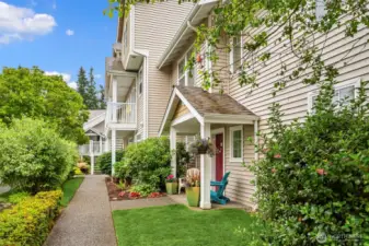 This home is extra special and is tucked away in a private corner with gorgeous surroundings! The grounds leading to your sweet corner, end unit are shown here. Nantucket at Harbour Pointe is well manicured, with no rental cap and no pet restrictions!