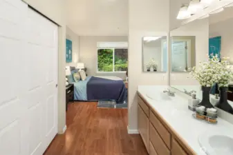 The en suite three quarter bathroom offers extra closet space and two sinks.