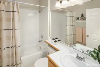 A full bathroom sits in the hallway adjacent to the second and third bedrooms, great to keep any guests out of your primary bathroom.