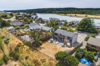 Back of the home showcases the proximity to the Swinomish Channel on one side and the farmlands on the other.
