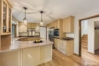 The kitchen is a chef's delight with Corian countertops, abundant cabinetry and a stainless steel appliance package.