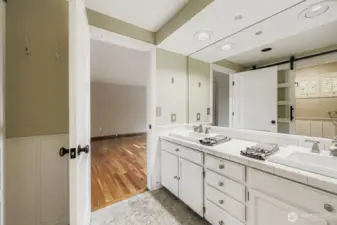 Dual sinks, tile countertops and abundant cabinetry