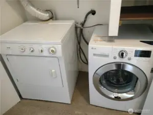 Located down the hallway , you will find your washer/dryer behind double doors.