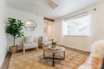 Inviting living room with abundant natural light, durable flooring, and a comfortable layout for everyday living or entertaining.