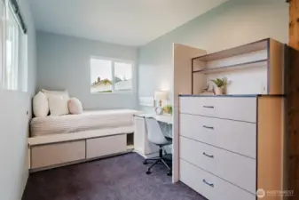 Custom built-in bed and desk create a functional, space-saving room—ideal for a home office, guest room, or flex space.