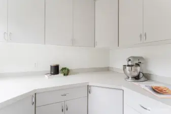 Cooks will love the additional counter space and cabinetry offering flexibility for storage, baking, or meal prep.