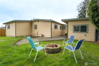 Fire pit area offers a comfortable outdoor gathering space.