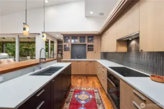 From this angle you can see at the end of the hall some beautiful built-in shelving for cookbooks & decorative vessels.  Around the corner from that is a walk-in pantry.