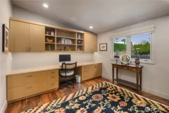 Main floor office with lots of handsome built-in cabinets.  There is a Soji screen door that can close the office off fromt eh hallway.