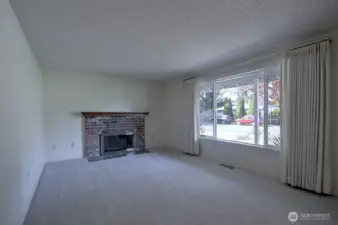 Living room with gas fireplace and huge picture window