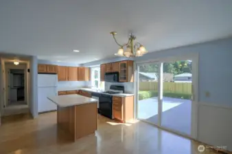 Off of the kitchen are sliding doors to the back deck