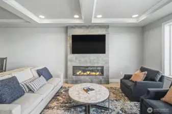 Contemporary living area featuring a statement fireplace and refined finishes.