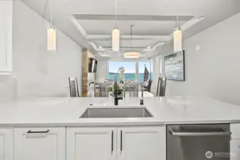 Oversized counters anchor the kitchen, perfect for prep, dining, and entertaining.