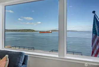 Expansive windows capture ever-changing waterfront scenery from the comfort of home.