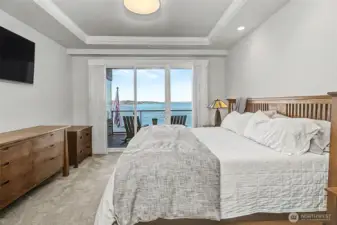 Primary bedroom retreat with serene views and abundant natural light.