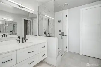 Walk-in shower and heated floors create a luxurious daily experience.