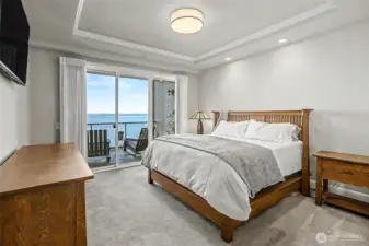 Primary suite with tranquil water views creates a peaceful retreat to start and end the day.