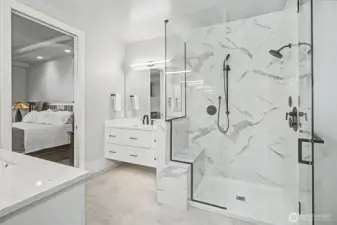 Walk-in shower and heated floors complete the spa-like experience of the primary bath.