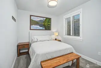 Additional bedroom offers versatility for guests, work, or relaxation.