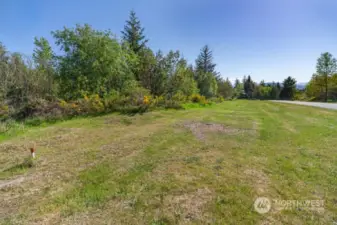 4.37 Acres.  Level with an easily imagined building site and potential of some sweet mountain views!  Nicely treed.