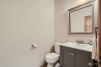 Lower level half bathroom.