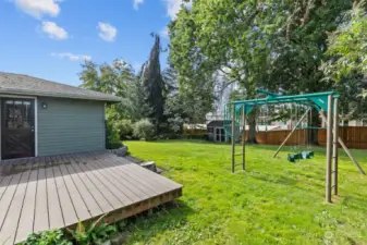 The spacious yard provides ample room for outdoor activities, from gardening to summer picnics.