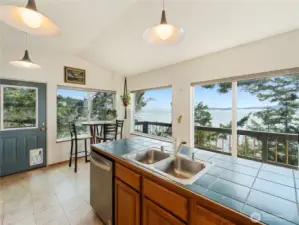 The back door leads around to the front deck & fenced-in area.