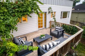 Autumn nights are calling you to this tranquil western deck. Watch the sun set over the Olympic Mountains in this lush outdoor living space.