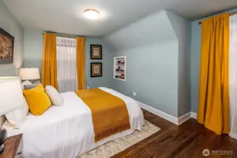 One of two additional top floor bedrooms with cute built in book shelf and city and mountain views.