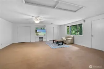 The great room offers plenty of possibilities for your uses and layouts, and features dual closets for storage and built in desk area.