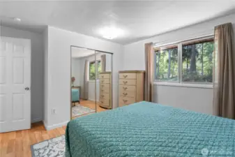 The closet includes full size mirrored sliding doors.