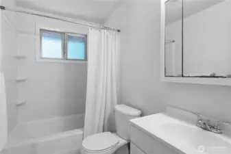 The bathroom features a bathtub and shower.