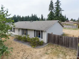 The east side of the home shows where you can access the back yard. You can even store an RV, boat along this part of the property if you like.