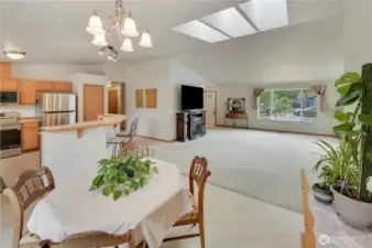 Love this open layout! With vaulted ceilings, skylights, and large windows, this home is light, bright, and welcomng.