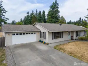 This 2007 home has an oversized garage, lots of driveway parking, plus a drive-through gate to the the back yard.