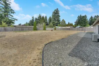 One of the largerst lots on the street, you'll love this shy 1/3 acre, fully fenced back yard. It's your private place for playing, pets, gardening, relaxing, and more.