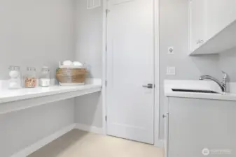 Convenient upper floor laundry room.