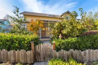 Fenced yard area with established gardens.