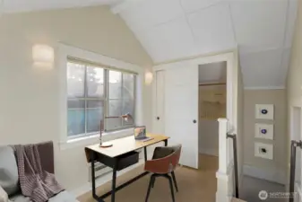 Upstairs guest room with closet.