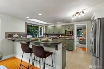 A long bar gives the chef company!