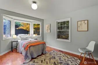 Main floor bedroom with big bay window.