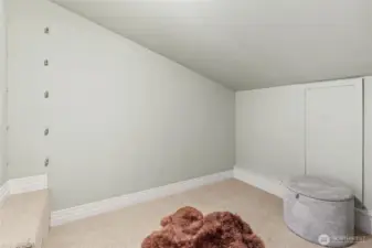 Large dressing area in the primary closet.