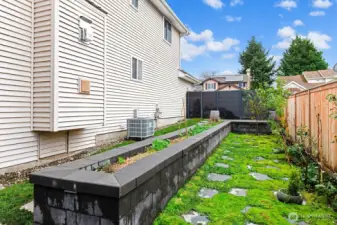 Custom designed raised planter bed and five varieties of fruit trees to bring your gardening dreams to life.