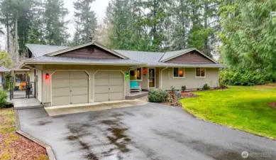 Escape to the country while staying close to amenities in this private home on one acre in Lake Tapps.
