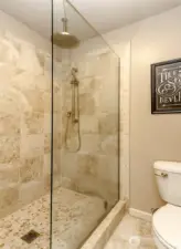 There's an elegantly tiled walk-in shower.