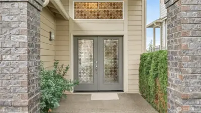 Enjoy stunning curb appeal with classic brick detailing & elegant double glass doors.