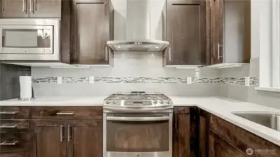 Kitchen also offers plenty of cabinet and counter space.