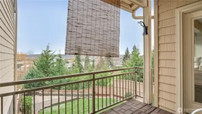 Easy outdoor living year-round on this spacious, covered balcony.